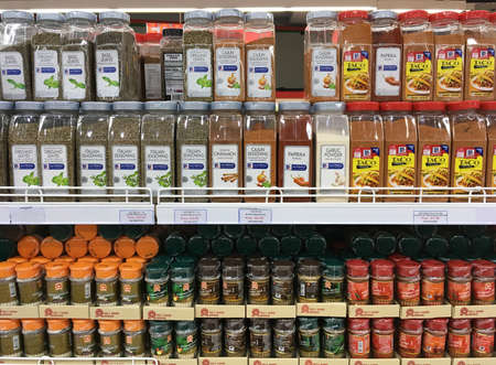 SIEM REAP, CAMBODIA - APRIL 29, 2020: Many jars of various spices and dried herbs at the Angkor market supermarket.のeditorial素材
