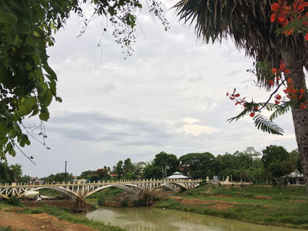 BATTAMBANG, CAMBODIA - MAY 23, 2020: A bridge over the Sangkae River. Founded in the 11th century by the Khmer Empire, Battambang is the leading rice producing province of the country.のeditorial素材