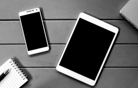 Digital tablet and smart phone on the working deskの写真素材