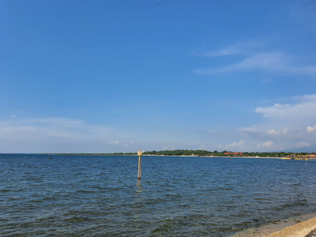 Landscape view of the lake and blue sky with white clouds.の写真素材
