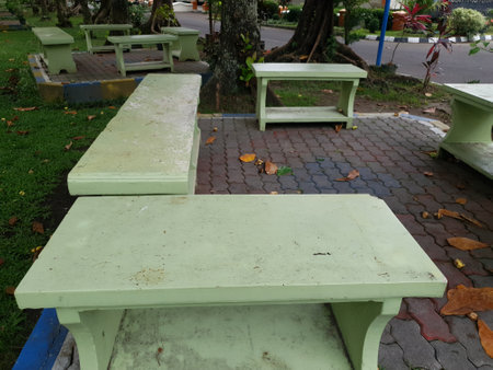Wooden table and chair in the public parkの写真素材
