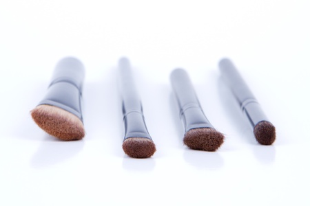 Set of black make-up brushes on white background