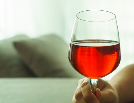 Glass of red wine, raisedの写真素材