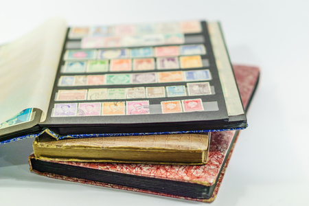 Collection of very old postage stamps in stamp booksのeditorial素材