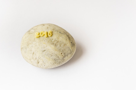 2016 new year sign arranged on minimal zen rockの写真素材