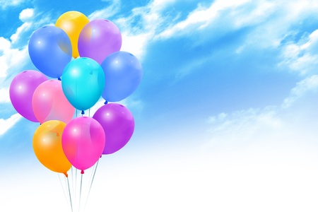Bunch colored balloons on a on blue skyの写真素材