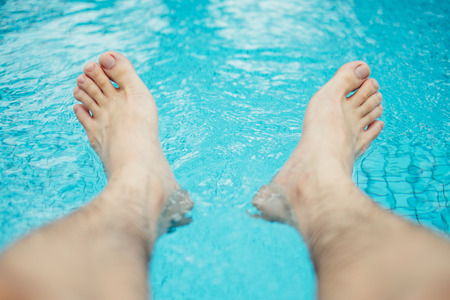 Chilling feet over the poolの写真素材