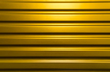 Futuristic yellow metal texture for background or templateの写真素材