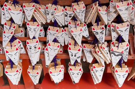 Ema, best wishes fox face hanger at Fushimi Inari Taisha Shrine in Kyotoのeditorial素材