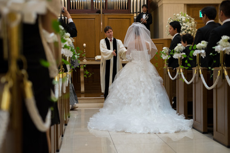 OSAKA, Japan - JULY : a father is blessing the bride in wedding ceremony at July 21, 2013 at local christian churchのeditorial素材