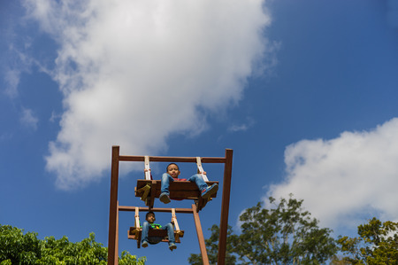 Chaingmai, Thailand - December : kids playing giant swing in December, 2013 at local villageのeditorial素材