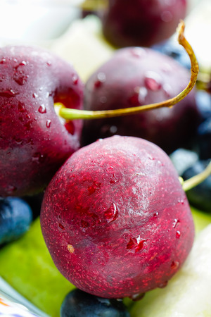 Macro cherry, blueberry, kiwi, guavaの写真素材