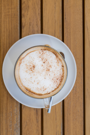 Coffee latte on wooden tableの写真素材
