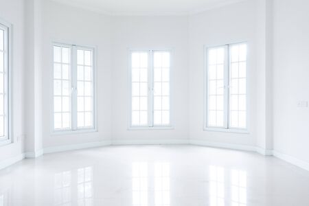 Empty white room with windows