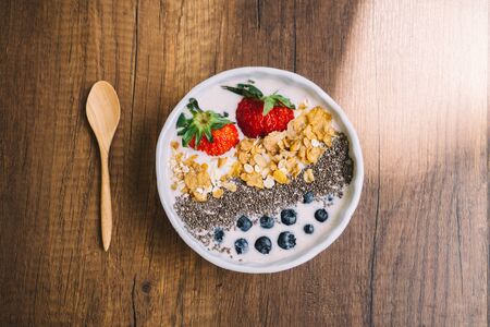 Yogurt with strawberry, blueberry, chia seed and cornflake film look styleの写真素材