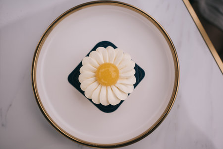 lemon yuzu tart on white plateの写真素材