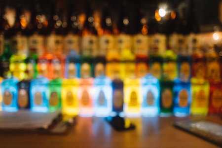 Blurry background of colorful alcohol bottlesの写真素材