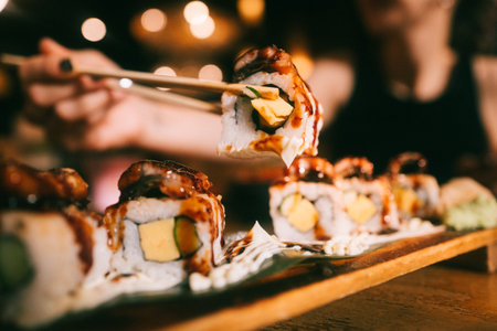 Unagi roll on wooden tray, film look styleの写真素材