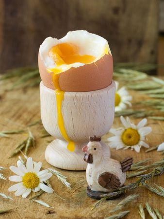 Soft boiled egg in wooden eggcup