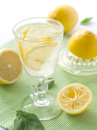 Lemonade with a lemon and ice.の写真素材