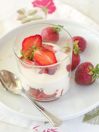 Yogurt with strawberries for   breakfast in glassの写真素材