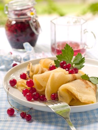 Pancakes with red currant jam for breakfastの写真素材