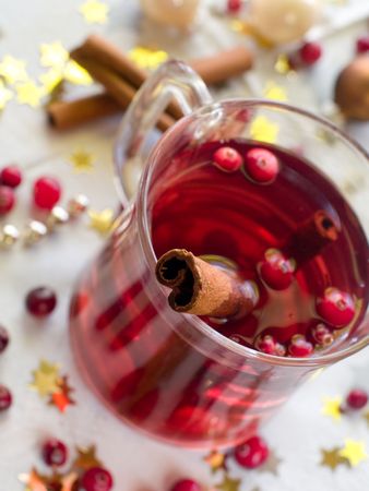Hot drink with cranberries and cinnamonの写真素材