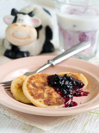 Pancake with cottage cheese and jam for breakfastの写真素材