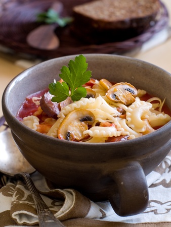 A bowl of stew with mushroom and pastaの写真素材