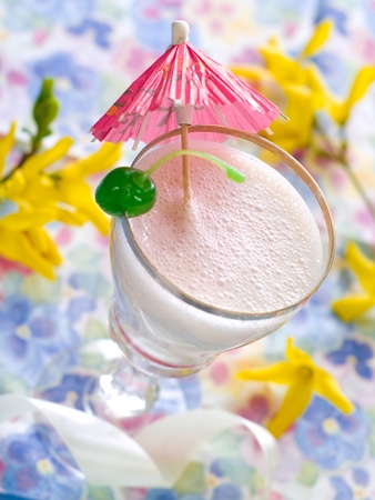 Vanilla milkshake with cherry garnish  with shallow depth of field.の写真素材