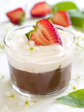 Chocolate Mousse dessert in a glass with strawberry. Shallow depth of field, focus on strawberryの写真素材