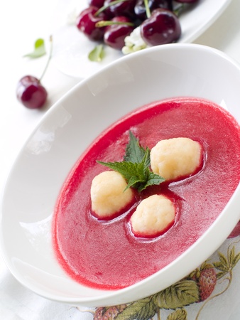 Sweet fruit soup with cottage cheese balls and mintの写真素材