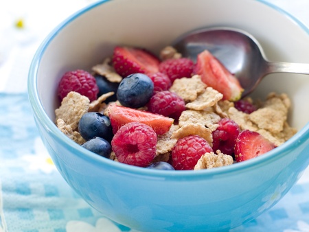 Oat flakes with berries and milk for breakfast. Selective focus