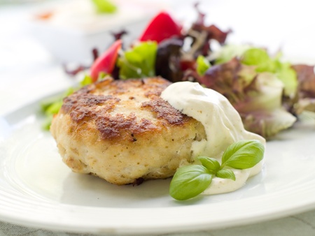 Chicken burger with fresh salad and sauce