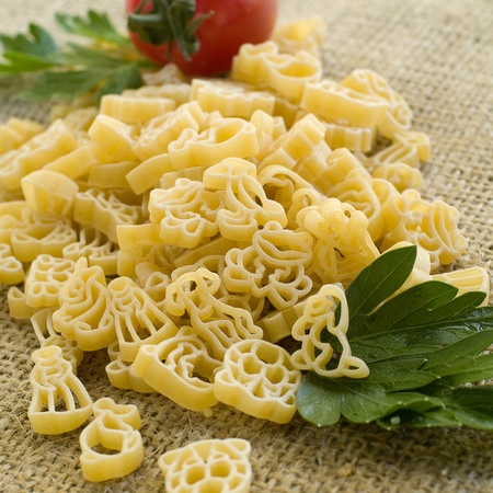 Pasta ingredients; fresh children makaroni, tomato, parsleySelective focus の写真素材