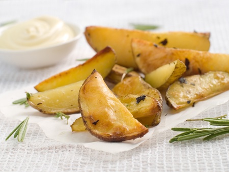 Roasted potatoes with herbs on baked paper. Selective focusの写真素材