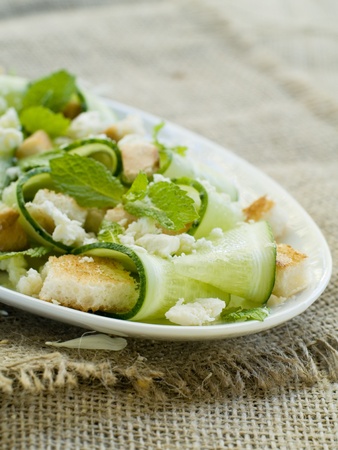 Fresh salad with cucumber and cheese. Selective focus の写真素材