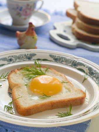 Fried toast with egg and dill. Selective focusの写真素材