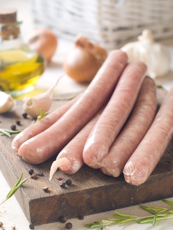 Fresh sausage on wood board, selective focus の写真素材