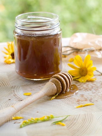 Flower honey in glass jar. Selective focusの写真素材