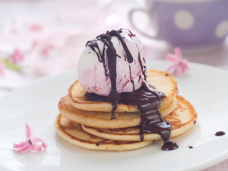 Pancake with ice cream and chocolate sauce, selective focusの写真素材