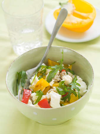 Couscous salad with feta cheese, arugula and pepper, selective focusの写真素材