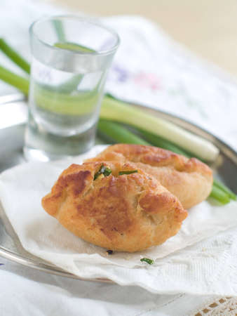 Traditional russian fish pies on plate, selective focus