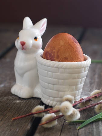 Easter egg in rabbit egg support, selective focus の写真素材