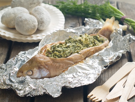Baked fish on board, selective focus 