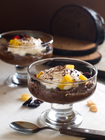 Sweet bread soup with dried fruit and whipped cream, selective focusの写真素材