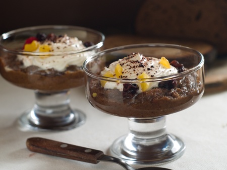 Sweet bread soup with dried fruit and whipped cream, selective focusの写真素材