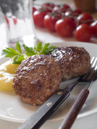 Minced meat ball with mashed potato, selective focus の写真素材