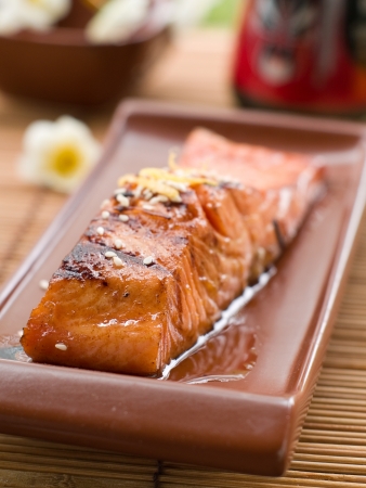 Grilled salmon fillet with sauce and sesame seeds, selective focusの写真素材