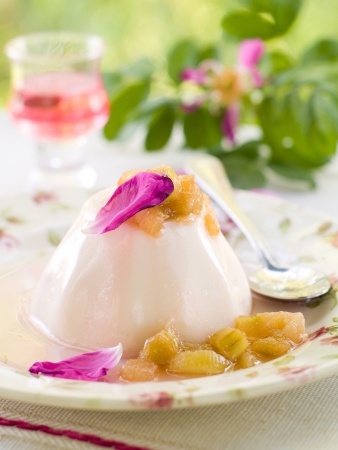 Milk dessert (pannacotta) with rhubarb and rose petal, selective focus の写真素材